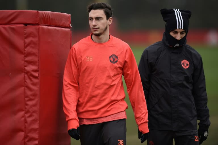 Manchester United's Matteo Darmian (L) and Henrikh Mkhitaryan attend a training session at their Carrington base in Manchester, on February 15, 2017