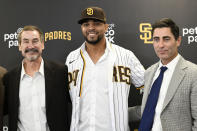 San Diego Padres' Xander Bogaerts, center, poses for a photo with Padres general manager A.J. Preller, right, and Padres Chairman Peter Seidler at a news conference held to announce that Bogaerts' $280 million, 11-year contact with the team has been finalized, Friday, Dec. 9, 2022, in San Diego. (AP Photo/Denis Poroy)