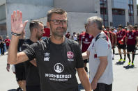 FILE - In this Tuesday, July 3, 2018 photo Michael Koellner, head coach of the German first division, Bundesliga, team 1. FC Nuremberg attends the new season's first training session in Nuremberg, Germany. (Timm Schamberger/dpa via AP, file)