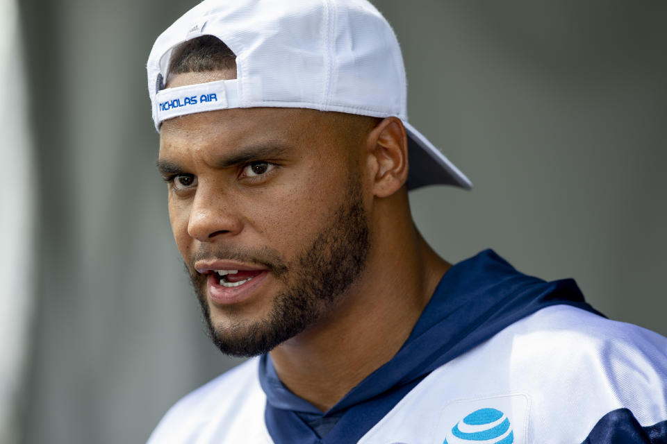 Dallas Cowboys quarterback Dak Prescott takes questions from the media after the morning walk through practice during NFL training camp, Friday, July 27, 2018, in Oxnard, Calif. (AP Photo/Gus Ruelas)