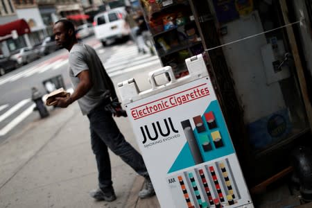 A man walks out of a shop selling vaping products in Manhattan in New York