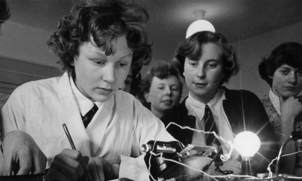 Pupils at Cleckheaton Grammar School in Yorkshire carry out a physics circuitry experiment with a lightbulb (1956)