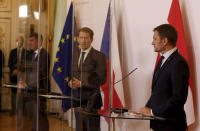 Prime Minister of Czech Republic Andrej Babis, Austrian Chancellor Sebastian Kurz and Slovakia's Prime Minister Igor Matovic, from left, behind plexiglass shields address the media during a press conference as part of a meeting at the federal chancellery in Vienna, Austria, Wednesday, Sept. 9, 2020. (AP Photo/Ronald Zak)
