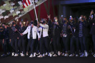 Sue Bird and Eddy Alvares, of the United States, carry their country's flag during the opening ceremony in the Olympic Stadium at the 2020 Summer Olympics, Friday, July 23, 2021, in Tokyo, Japan. (Hannah McKay/Pool Photo via AP)