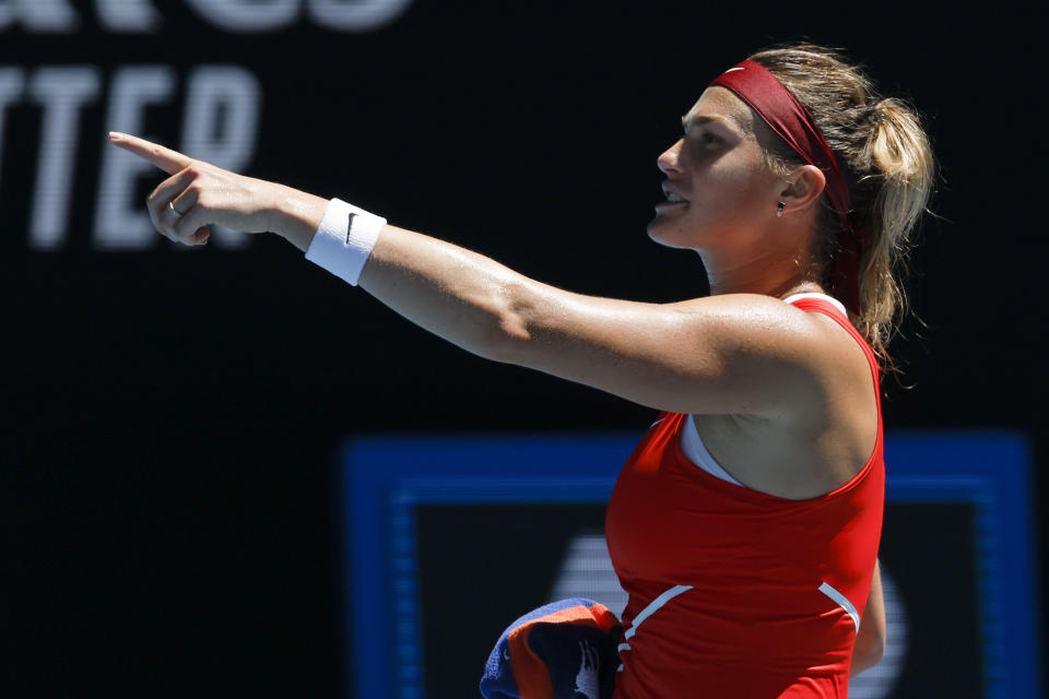 Aryna Sabalenka of Belarus celebrates after defeating Wang Xinyu of China in their second round match at the Australian Open tennis championships in Melbourne, Australia, Thursday, Jan. 20, 2022. (AP Photo/Hamish Blair)