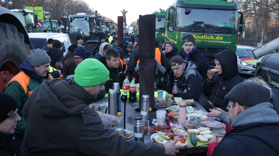 Protesting farmers have breakfast among their tractors and trucks in Berlin on January 8. - Sean Gallup/Getty Images