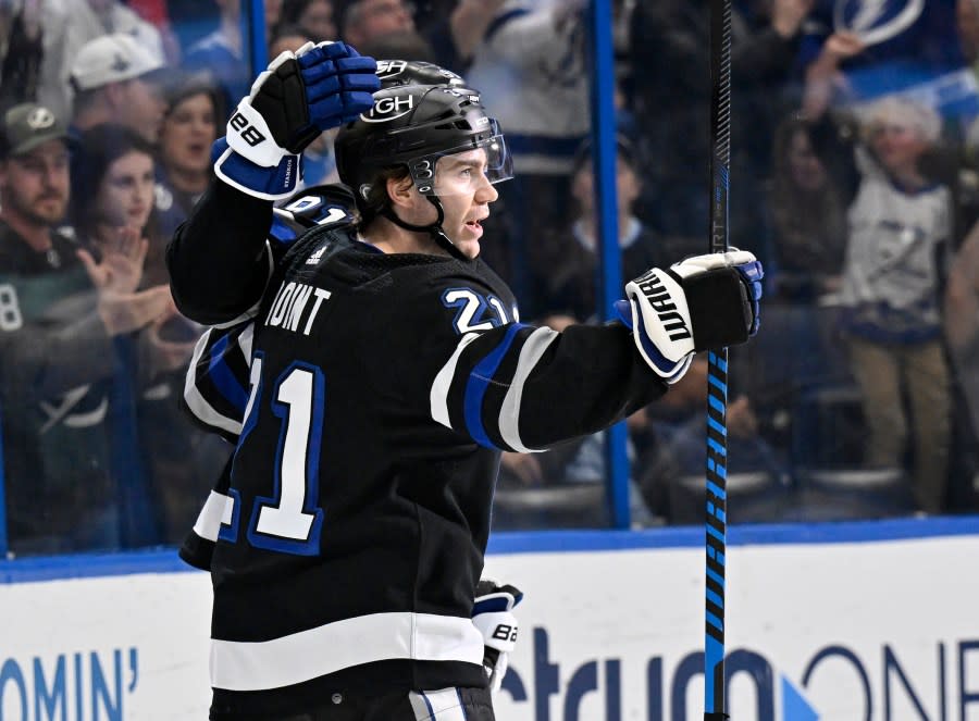 Tampa Bay Lightning center Brayden Point (21) celebrates his goal during the second period of an NHL hockey game against the Montreal Canadiens, Saturday, March 2, 2024, in Tampa, Fla. (AP Photo/Jason Behnken)