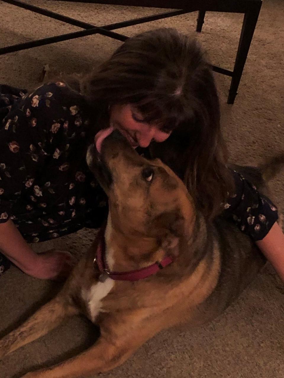 Jessie gives her person, Jamie LaReau, a Christmas kiss in this picture taken at Christmas in 2018.