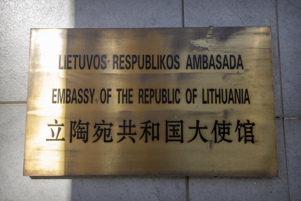 FILE - The nameplate for the Lithuanian Embassy is seen on the outside of the embassy building in Beijing, on Dec. 16, 2021. The U.S. State Department has set up an eight-person team known as the "firm" to provide help to countries cut off from Chinese trade. The team emerged after Washington stepped in to help Lithuania when the northern European country found its cargo shipments to and from China stranded two years ago during a feud over Taiwan. (AP Photo/Mark Schiefelbein, File)