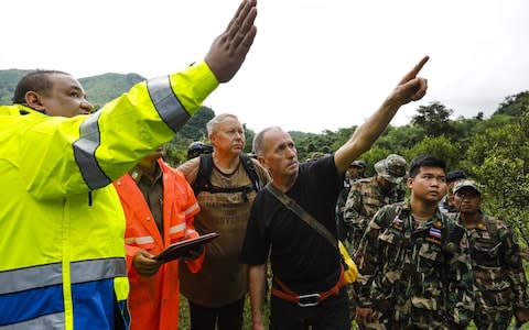 British caver Vernon Unsworth (centre) works with with Thai army soldiers and local rescue personnel during the rescue operation - Credit: AFP