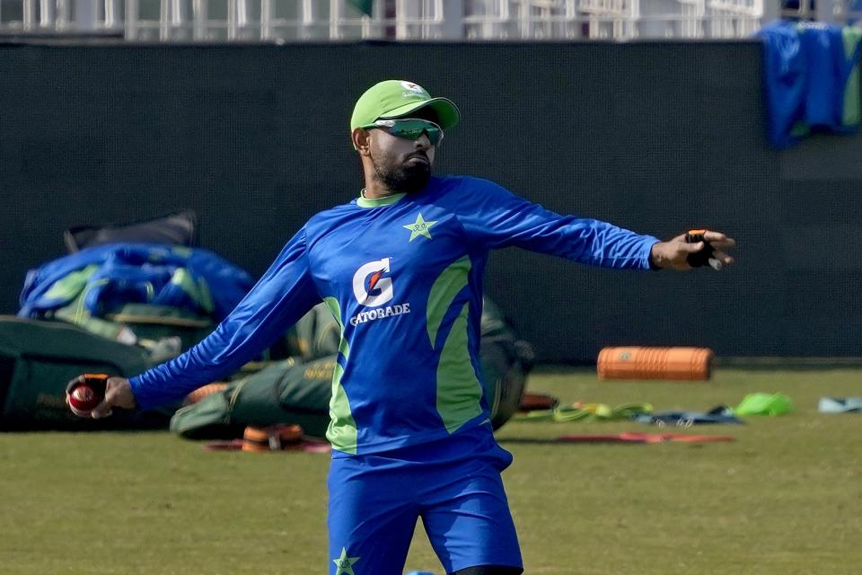 Pakistan's skipper Babar Azam throws a ball during a training session, in Rawalpindi, Pakistan, Monday, Nov. 28, 2022. Pakistan and England teams will play three-test cricket matches starting from Dec. 1. (AP Photo/Anjum Naveed)