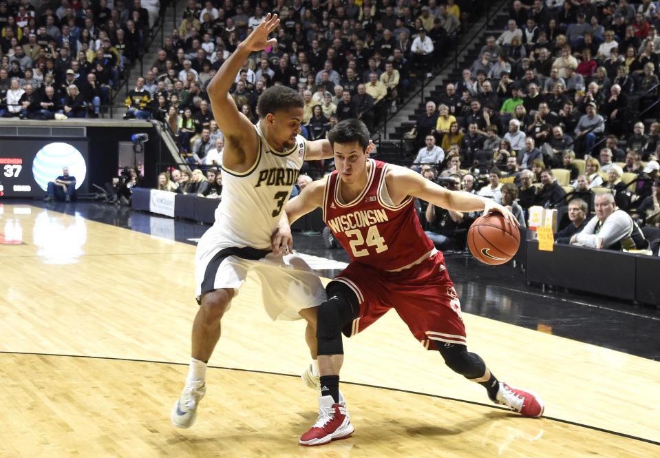 Mar 6, 2016; West Lafayette, IN, USA; Wisconsin Badgers guard Bronson Koenig (24) drives on Purdue Boilermakers guard P.J. Thompson (3) at Mackey Arena. Purdue won the game 91-80. Mandatory Credit: Sandra Dukes-USA TODAY Sports