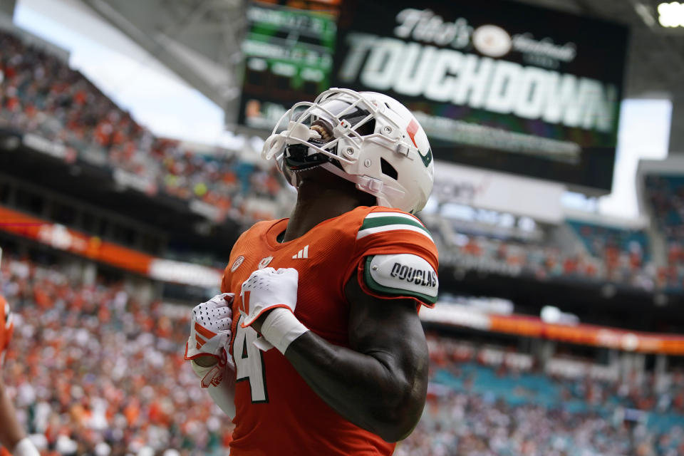 Miami wide receiver Colbie Young (4) reacts after scoring a touchdown during the first half of an NCAA college football game against Texas A&M, Saturday, Sept. 9, 2023, in Miami Gardens, Fla. (AP Photo/Lynne Sladky)