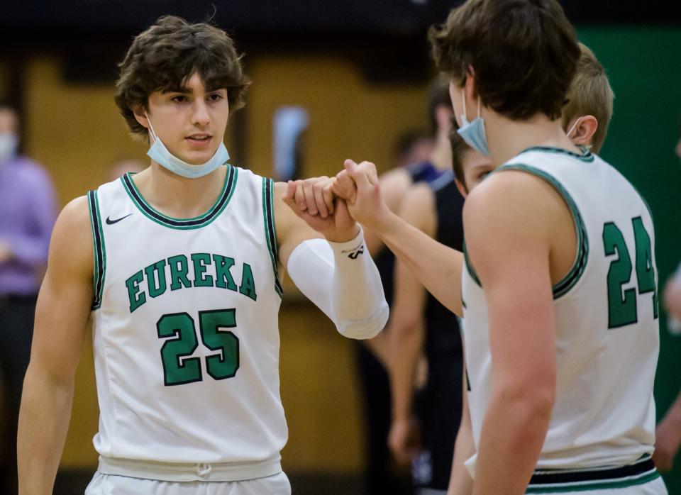 Brothers Trevor (25) and Tyler Heffren bump fists during player introductions before their game against El Paso-Gridley on Friday, Jan. 7, 2022 at Eureka High School. The Hornets fell to the Titans 55-46.