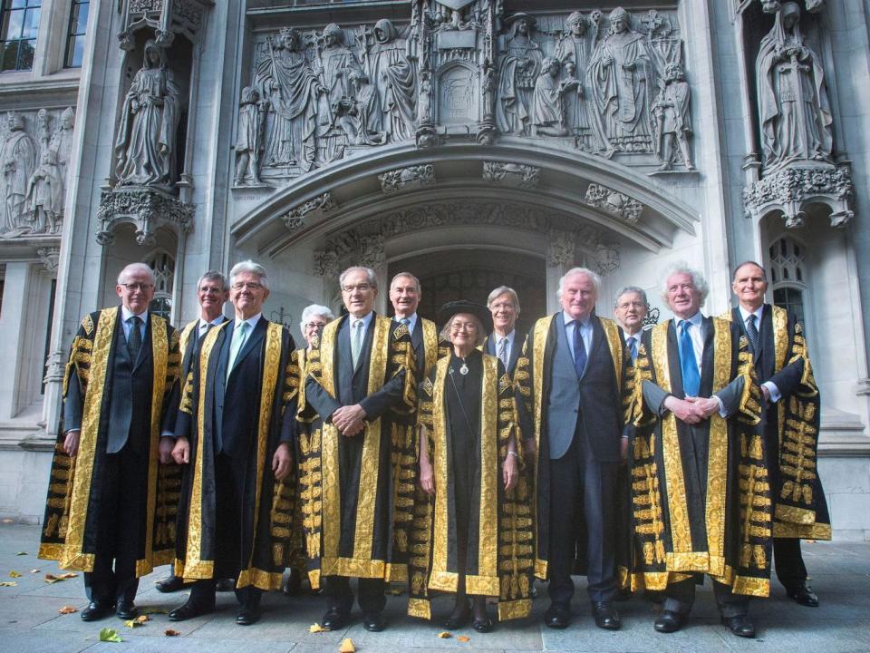 Lady Hale (centre) poses with other new justices after she was sworn in as the first female president of the UK's highest court, the Supreme Court (PA)