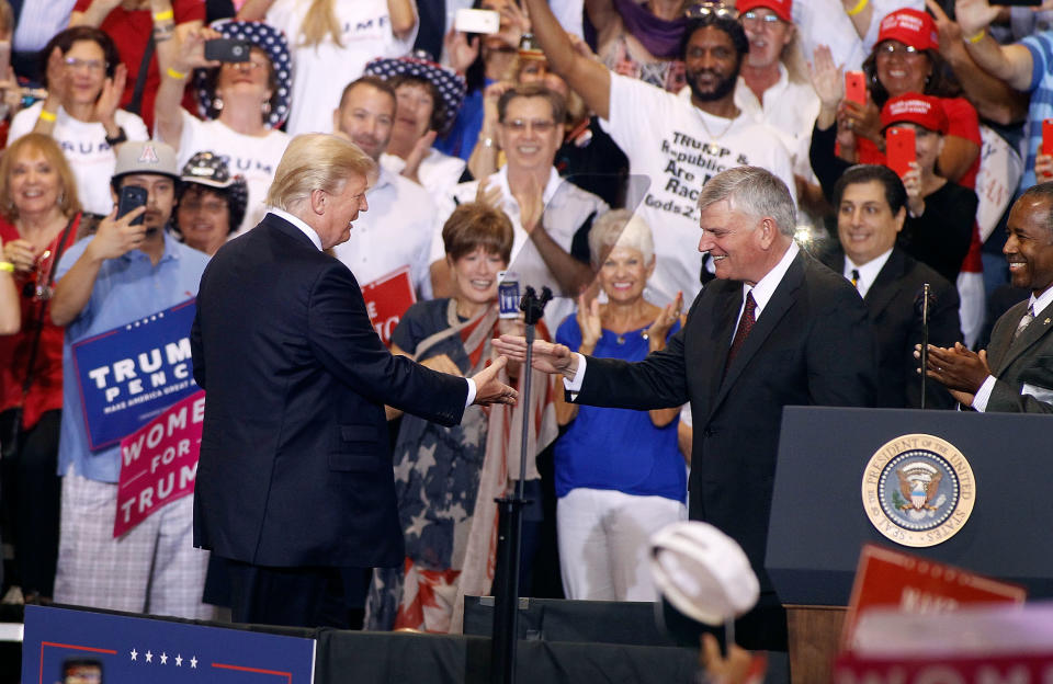 Franklin Graham is greeted by President Donald Trump during a rally on Aug. 22, 2017, in Phoenix. (Photo: Ralph Freso via Getty Images)