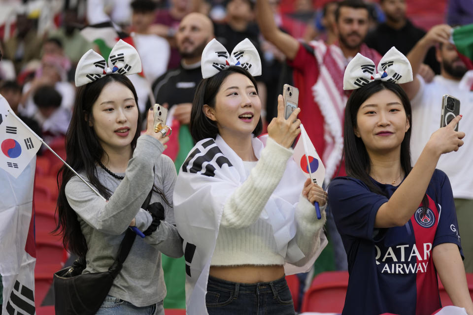 South Korean fans wait for the start of the Asian Cup Group E soccer match between Jordan and South Korea at Al Thumama in Doha, Qatar, Saturday, Jan. 20, 2024. (AP Photo/Aijaz Rahi)