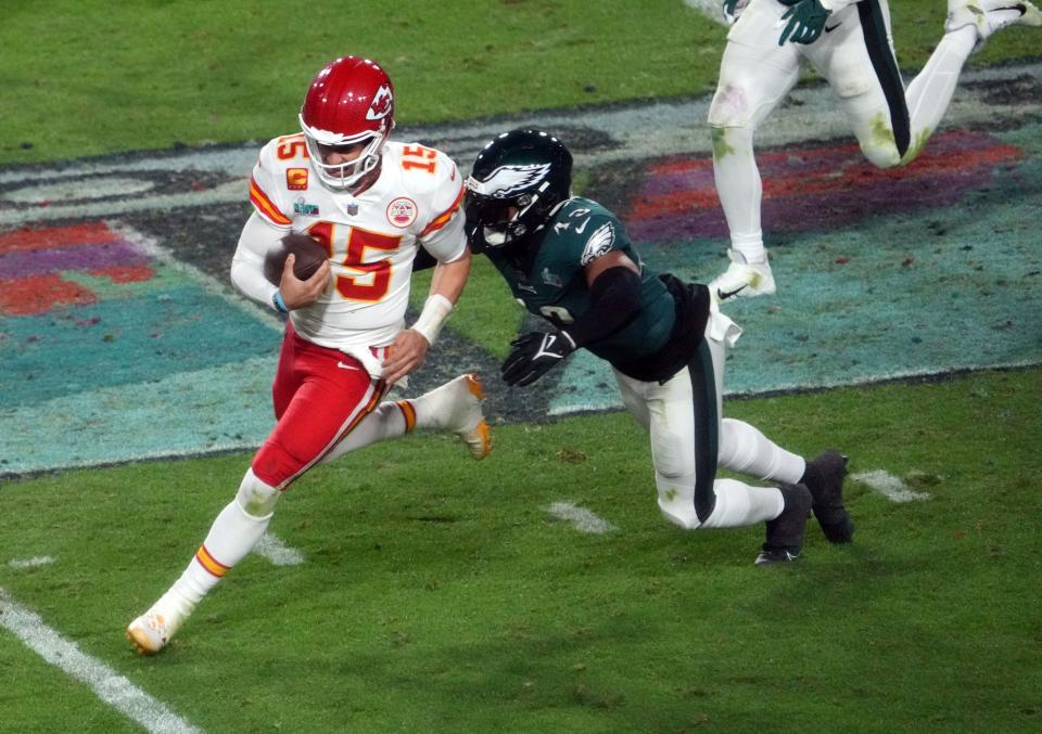 Kansas City Chiefs quarterback Patrick Mahomes (15) is tackled by Philadelphia Eagles linebacker Kyzir White (43) in the 4th quarter in Super Bowl LVII at State Farm Stadium in Glendale on Feb. 12, 2023.