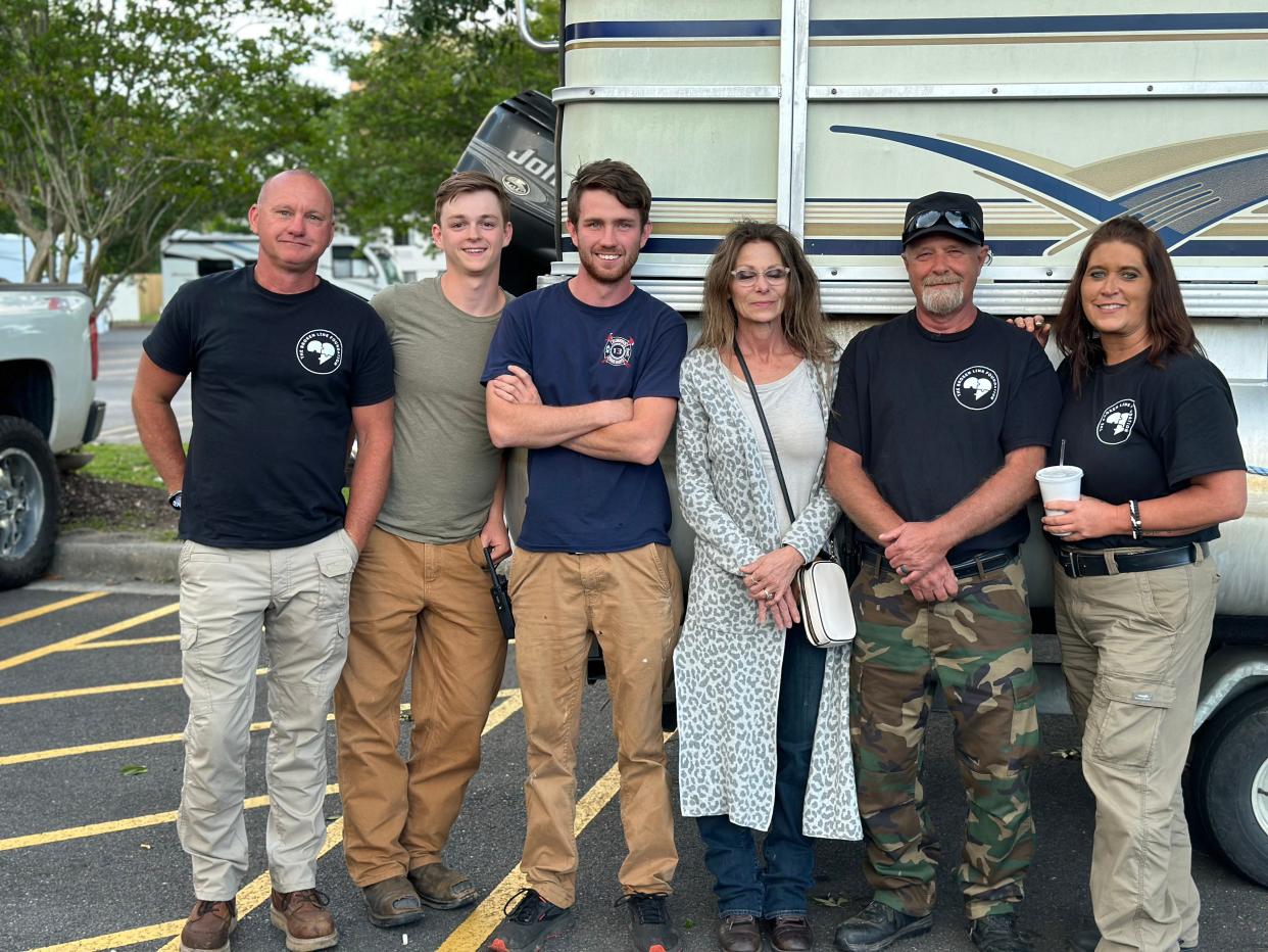 Members of the Broken Link Foundation, a South Carolina organization helping to find missing people. Pictured left to right are David Loveless, Tanner Loveless, Loy Miller, a woman whose son the group helped locate, Roger Coates and organization founder Kimberly Kite.