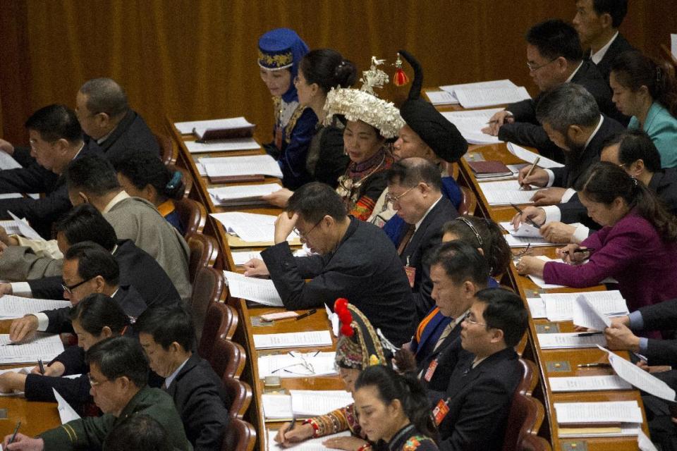 Delegates attend the opening session of the annual National People's Congress in Beijing's Great Hall of the People, Sunday, March 5, 2017. China's top leadership as well as thousands of delegates from around the country are gathered at the Chinese capital for the annual legislature meetings. (AP Photo/Ng Han Guan)