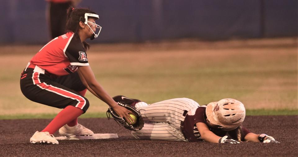 Eula's Hallie Cauthen, right, slides toward second base as Aspermont shortstop Leah Salazar tries to make the tag.