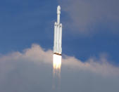 <p>A SpaceX Falcon Heavy rocket climbs towards space after lifting off from historic launch pad 39-A at the Kennedy Space Center in Cape Canaveral, Fla., Feb. 6, 2018. (Photo: Joe Skipper/Reuters) </p>