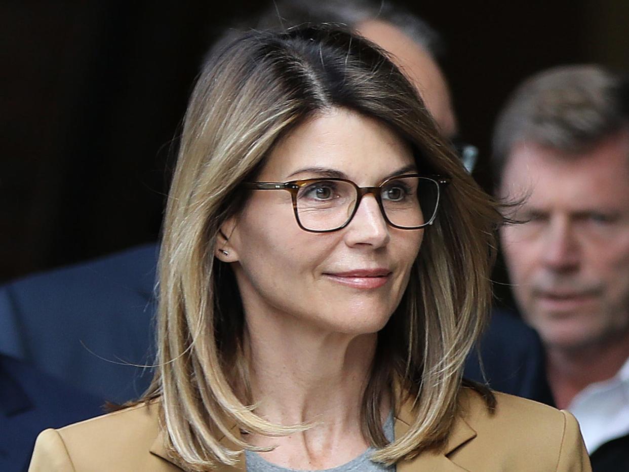 Lori Loughlin and her husband Mossimo Giannulli leave a Boston courthouse in April 2019.