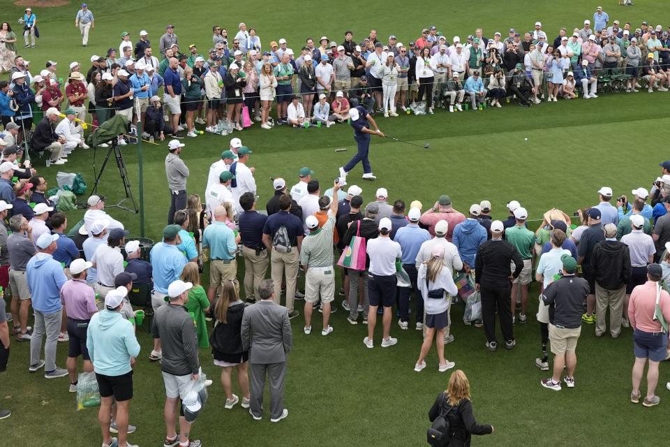 Scottie Scheffler tees off on the eighth hole during a practice round in preparation for the Masters golf tournament at Augusta National Golf Club Tuesday, April 9, 2024, in Augusta, Ga. (AP Photo/Ashley Landis)