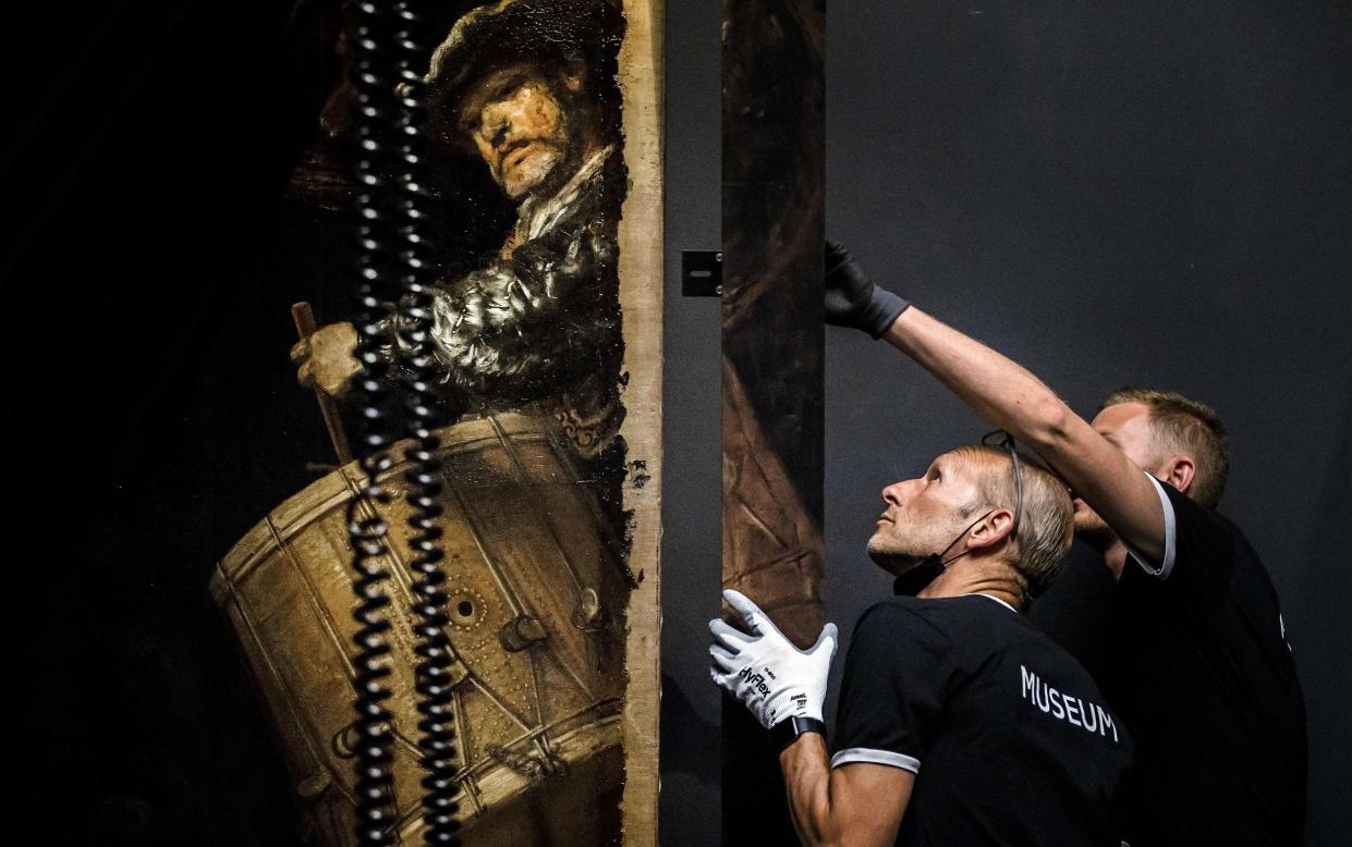 A frame being added to Rembrandt's 1642 'Night Watch' at the Rijksmuseum in Amsterdam - REMKO DE WAAL /AFP