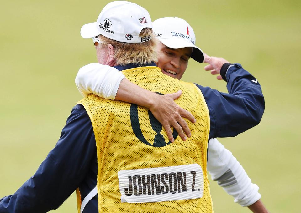 Zach Johnson of St. Simons Island, Ga., hugs caddie Damon Green after winning the 2015 Open Championship at St. Andrews.