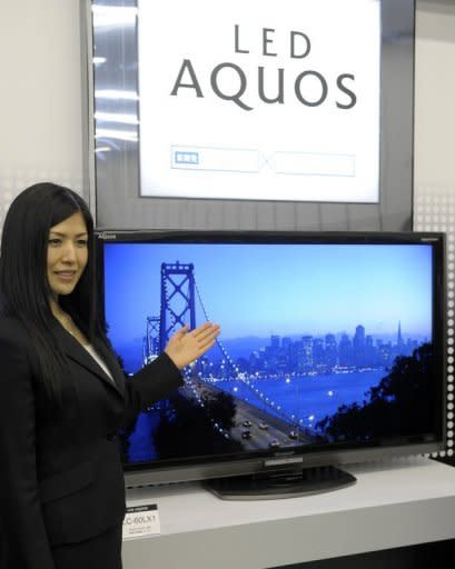 This file photo shows a Sharp's LCD TV display, LED AQUOS LC-60LX1, being presented at the company's Tokyo headquarters, in 2009. The century-old consumer electronics giant suffered a bloodletting this month with its Tokyo-traded shares diving to near 40-year lows after it reported huge quarterly losses and warned of more red ink to come
