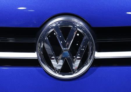 A Volkswagen (VW) logo is pictured on a car on the company's booth during the second media day of the 86th International Motor Show in Geneva, Switzerland, March 2, 2016. REUTERS/Denis Balibouse