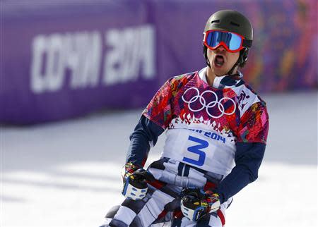 Russia's Vic Wild reacts during the men's parallel slalom snowboard finals at the 2014 Sochi Winter Olympic Games in Rosa Khutor February 22, 2014. REUTERS/Lucas Jackson