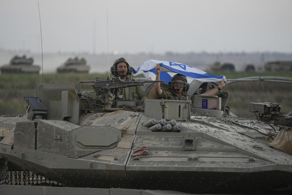 Israeli tanks head towards the Gaza Strip border in southern Israel on Thursday, Oct.12, 2023. (AP Photo/Ohad Zwigenberg)