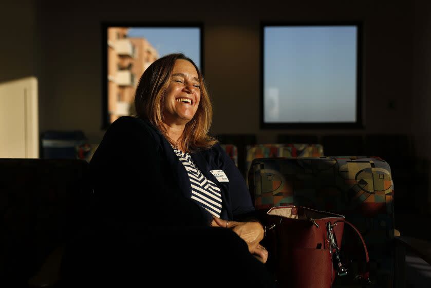 **DO NOT PUBLISH. PHOTOS FOR MCKENZIE PROJECT ONLY** Case manager Leslie Kerr is all smiles in the labor and delivery waiting room while Mckenzie is prepped for her Caesarean section at Adventist Health White Memorial hospital in Los Angeles. (Christina House / Los Angeles Times)**DO NOT PUBLISH. PHOTOS FOR MCKENZIE PROJECT ONLY** ***FINAL TONED***