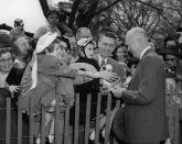 <p>President Dwight D. Eisenhower greets the crowd who have come for the Easter Egg Roll on the South Lawn of the White House in Washington, April 2, 1956. </p>