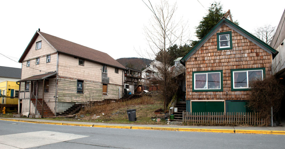 Some of the remaining clan houses in the Sitka Indian Village are seen in this undated photo. There were originally more than 40 houses, and they served as more than dwellings. The clan houses were cited by both historic preservation organizations as being among the most at-risk historic properties in Alaska and the nation. Preservation efforts are focusing on restoring and rebuilding structures, sorting out land ownership and strengthening Tlingit tradition. (Photo by James Poulson/provided by National Trust for Historic Preservation)