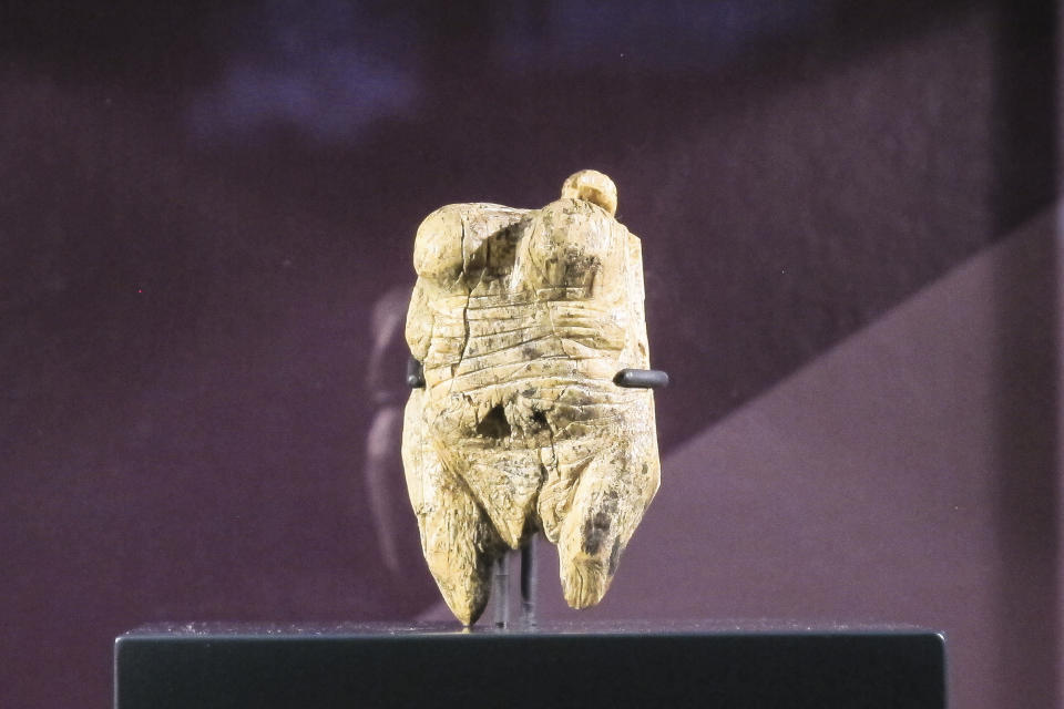 Venus von Hohle Fels, an ivory figurine dating back to between 40,000 and 35,000 BC, displayed at the Martin-Gropius-Bau museum in Berlin, Thursday, Sept. 20, 2018. The new exhibition showcasing more than 1,000 major archaeological finds from the past 20 years shows reveals how Germany has been at the heart of European trade, migration, conflict and innovation since the Stone Age. The exhibition runs from Sept. 21, 2018 until Jan. 6, 2019. (AP Photo/Frank Jordans)