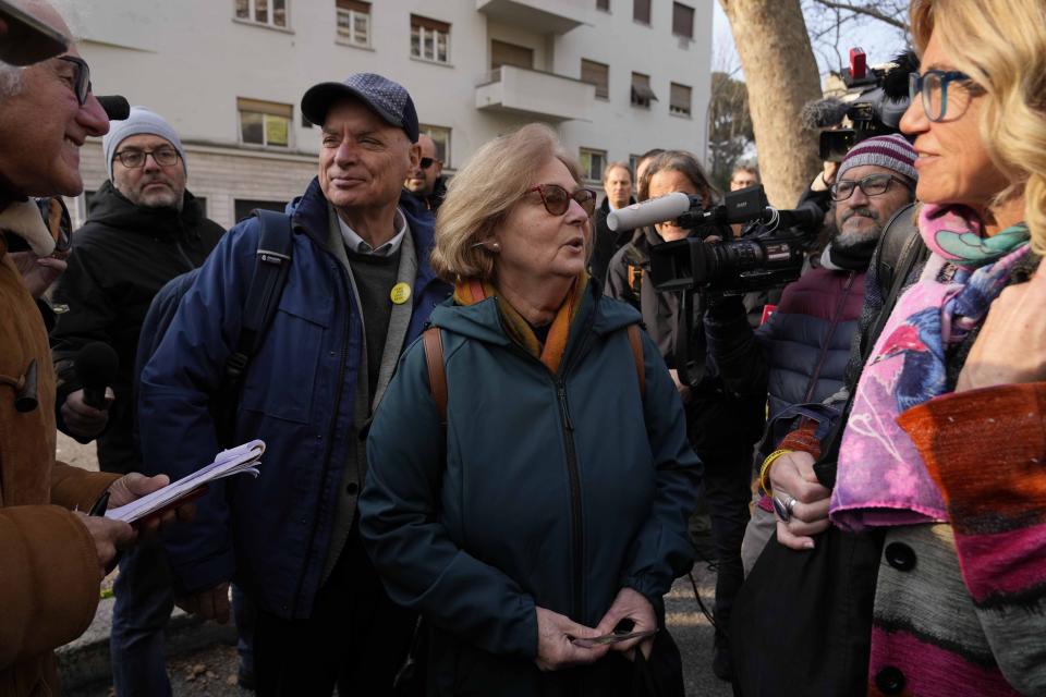 Paola, mother of Giulio Regeni, is flanked by by her husband Claudio as they arrive prior to the start of the trial for the killing of Cambridge University researcher Giulio Regeni, at the Rome's court, Tuesday, Feb. 20, 2024. Four high-level Egyptian security officials are going on trial in absentia in a Rome court, accused in the 2016 abduction, torture and slaying of an Italian doctoral student in Cairo. (AP Photo/Andrew Medichini)