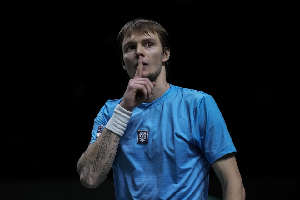 Kazakhstan's Alexander Bublik gestures to the crowd after beating Canada's Vasek Pospisil during their Davis Cup tennis match at Madrid Arena in Madrid, Spain, Sunday, Nov. 28, 2021. (AP Photo/Bernat Armangue)