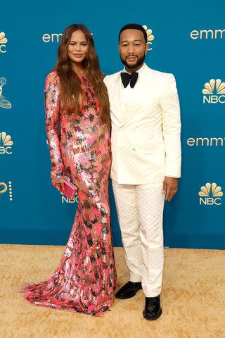 A then-pregnant Chrissy Teigen and her husband. John, Legend, attend the 2022 Emmys