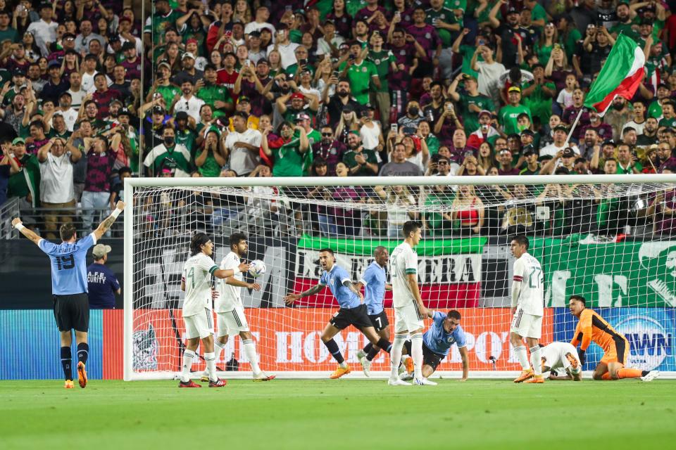 Uruguay's midfielder Mat’as Vecino (5), center, scores the team's opening goal during the first half between Mexico and Uruguay at State Farm Stadium on Thursday, June 2, 2022, in Glendale.