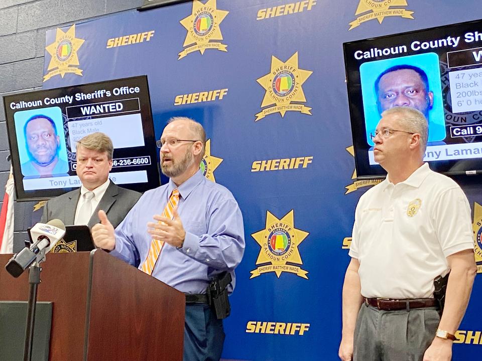 Calhoun County Sheriff Matthew Wade, center, is flanked by Calhoun County District Attorney Brian McVeigh, left, and Oxford Police Chief Bill Partridge Tuesday during a press conference on the kidnapping of an elderly woman on Monday.