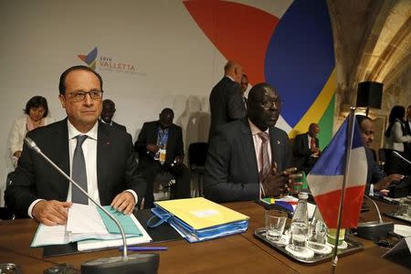 French President Francois Hollande (L) and Gambia's trade minister Abdoulie Jobe attend the Valletta Summit on Migration in Valletta, Malta, November 12, 2015. REUTERS/Darrin Zammit Lupi