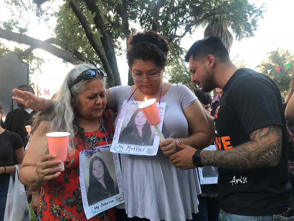 Family members of Claudine Ann Luera pray during a candlelight vigil in Laredo in September 2018. Luera was the second victim allegedly killed by U.S. Border Patrol agent Juan David Ortiz in 2018. His trial begins on Monday, Nov. 28.