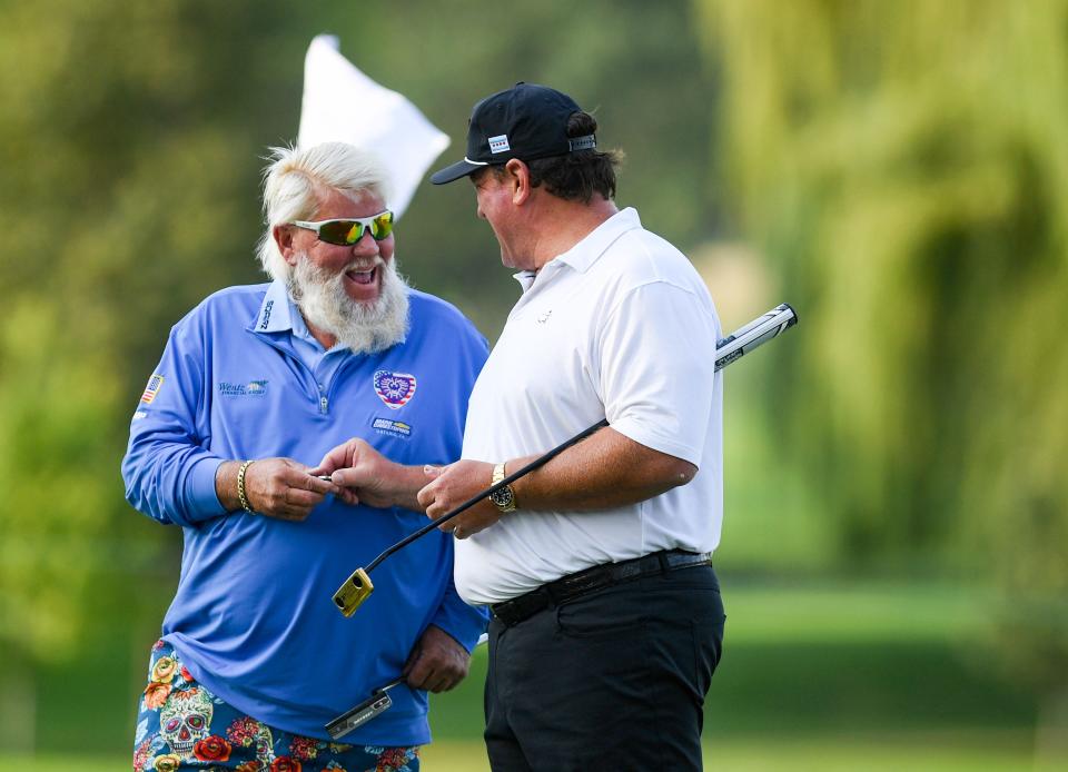 John Daly chats with Ben Graham during the EMC Championship Pro-Am of the Sanford International Golf Tournament on Wednesday, September 14, 2022, at Minnehaha Country Club in Sioux Falls.