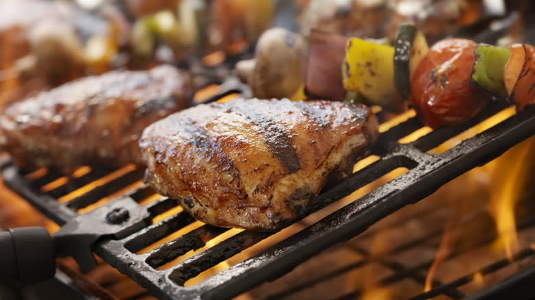 turkey thighs and vegetables on grill