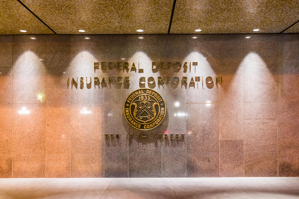 United States Federal Deposit Insurance Corporation sign on wall of building with logo on 17th street in evening night closeup