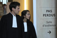 Salah Abdeslam's lawyers Olivia Ronen, right, and Martin Vettes arrive at the court room Wednesday, June 29, 2022 in Paris. Over the course of an extraordinary nine-month trial, the lone survivor of the Islamic State extremist team that attacked Paris in 2015 has proclaimed his radicalism, wept, apologized to victims and pleaded with judges to forgive his "mistakes." For victims' families and survivors of the attacks, the trial for Salah Abdeslam and suspected accomplices has been excruciating yet crucial in their quest for justice and closure. At long last, the court will hand down its verdict Wednesday. (AP Photo/Michel Euler)