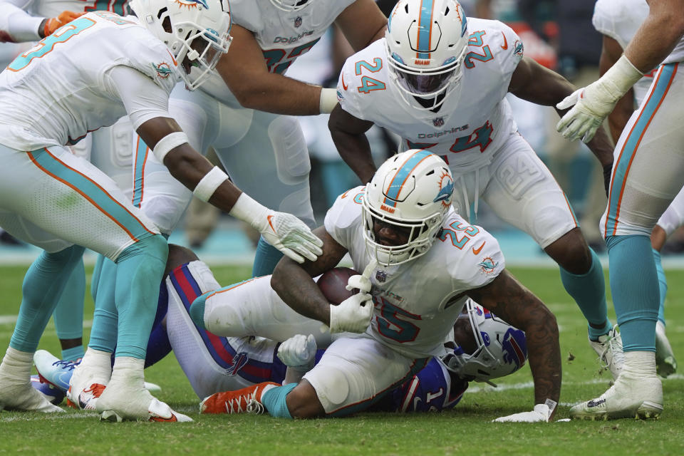 Miami Dolphins cornerback Xavien Howard (25) intercepts a pass intended for Buffalo Bills wide receiver Stefon Diggs (14) during the first half of an NFL football game, Sunday, Sept. 19, 2021, in Miami Gardens, Fla. (AP Photo/Hans Deryk)